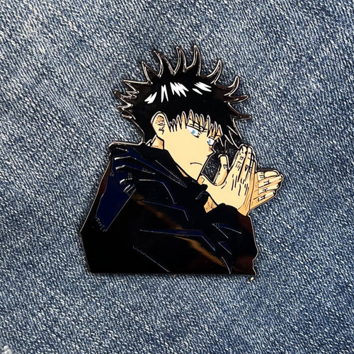 2.5-inch hard-enamel pin of Fushigoro Megumi from the anime Jujutsu Kaisen (JJK). Front of the pin shown. Nickel pin with black plating. Anime, Sorcerer, Toji, demon dog, Shibuya, curse, sukuna, collector, LE, limited run