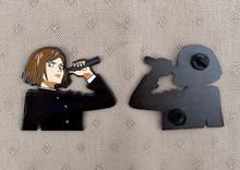 Load image into Gallery viewer, 2.5-inch hard-enamel pin of Kugsaki Nobara from the anime Jujutsu Kaisen (JJK). Front and back of the pin shown with two pin posts. Nickel pin with black plating. Anime, Sorcerer, Toji, Shibuya, curse, sukuna, collector, LE, limited run
